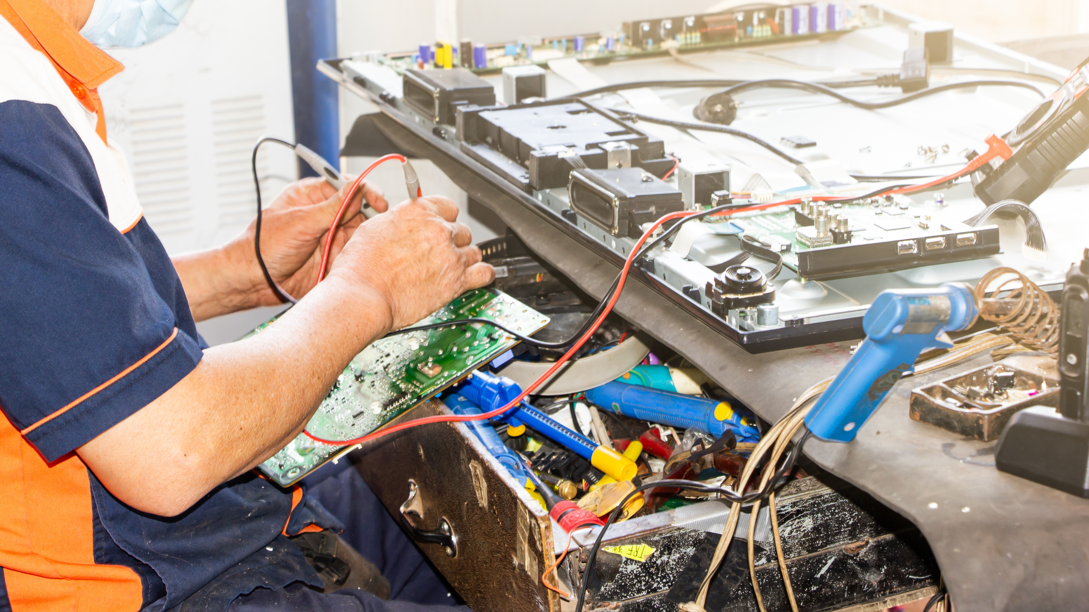 Technician Fixing TV